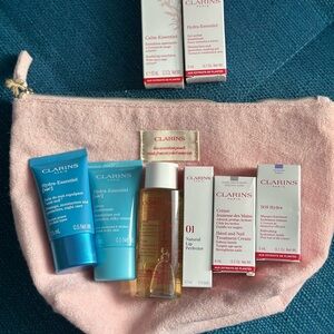 Clarins Skincare Set with pink make up pouch